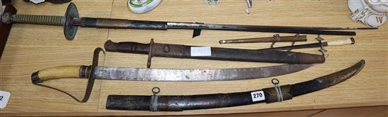 A bone-handled sword, a French epee, a Remington bayonet and a dagger